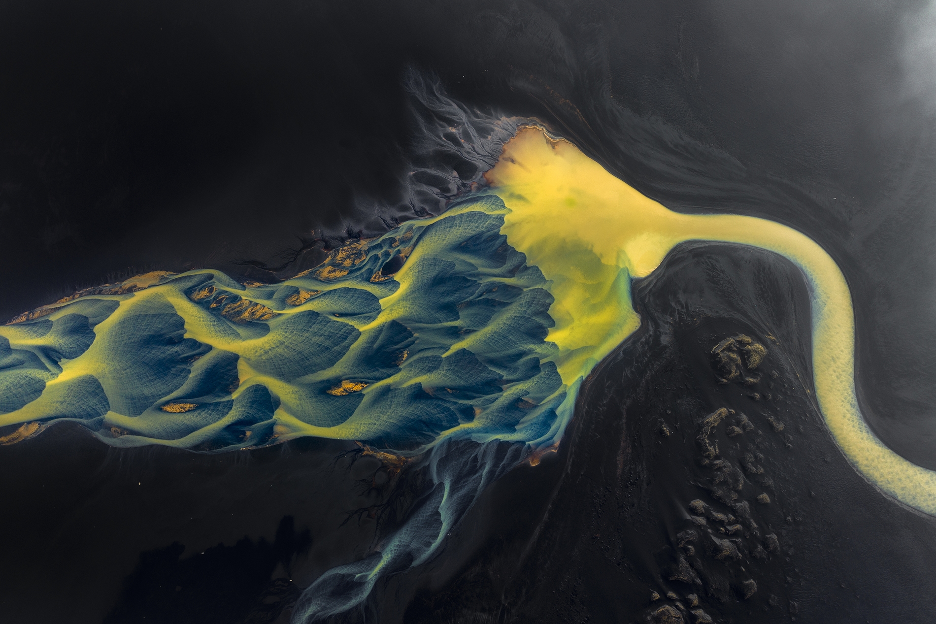 Blue watery veins, glacial braids and golden sediment – Iceland