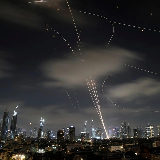 The Israeli Iron Dome air defense system fires to intercept missiles during an Iranian attack over Tel Aviv, Israel, early Wednesday June 18, 2025.