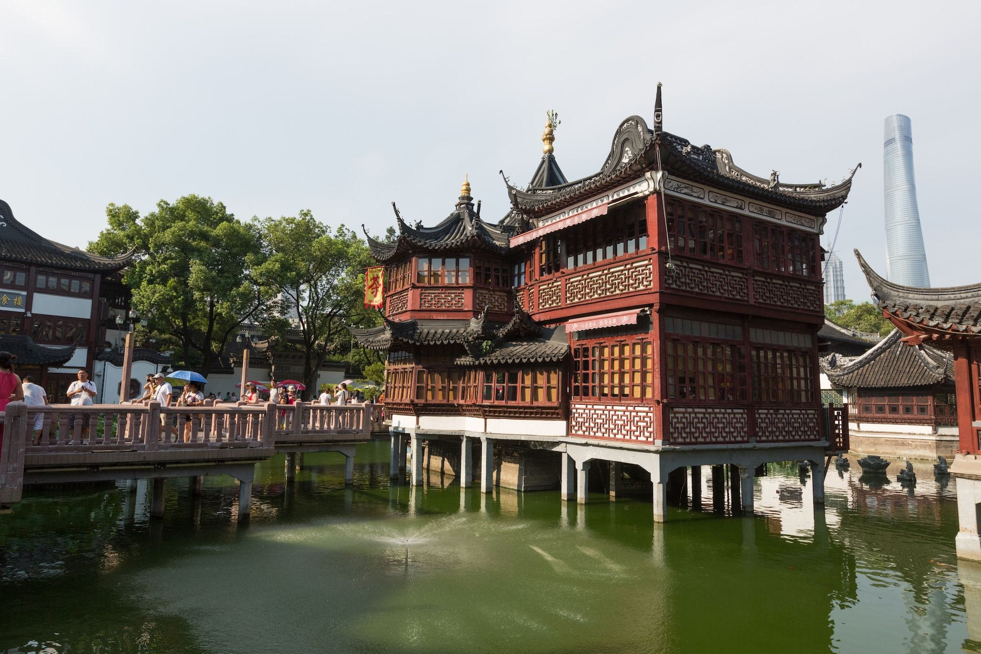 Shanghai, China - August 5, 2015: People walk past the Yuyuan Bazaar in Shanghai, China. The bazaar is adjacent to the Yuyuan Gardens which date from the Ming Dynasty and the entire complex is a major tourist attraction.